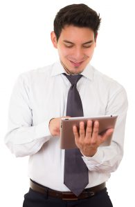 Young successful businessman with tablet, latin